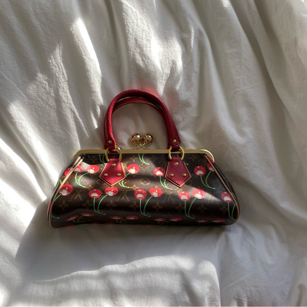 Elegant cherry accent clasp top handle Bag